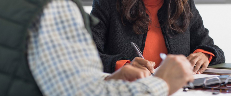 Woman writing notes down