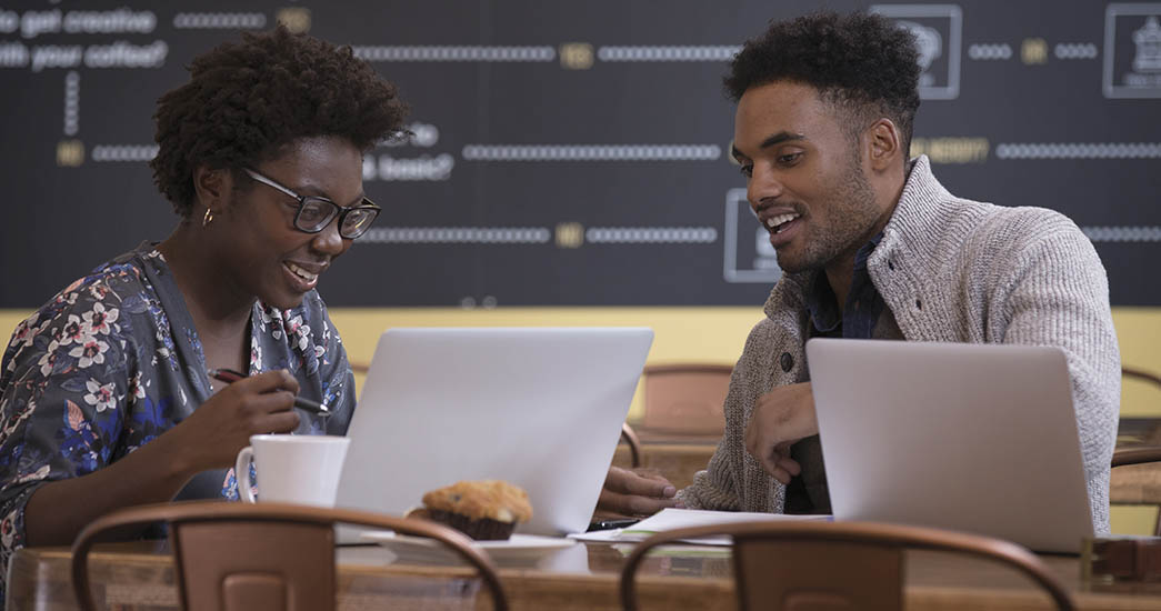 Clients having a fun conversation at a coffee house
