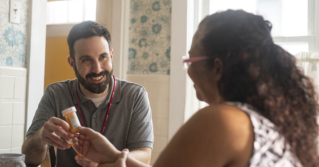 Employee talking to a nurse about prescriptions