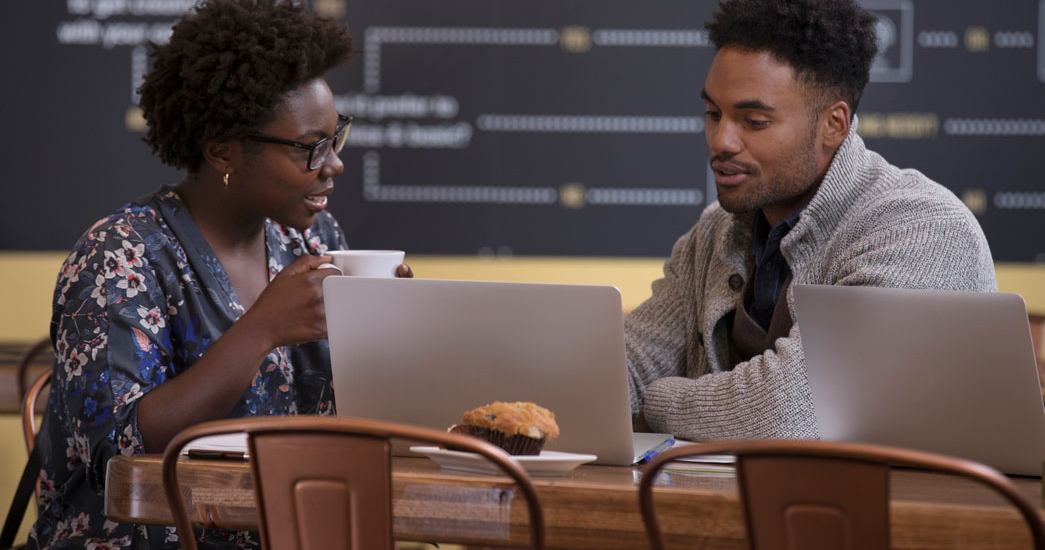 Client speaking with employer at a coffee shop