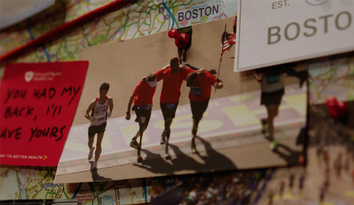 Runners crossing the Boston marathon finish line