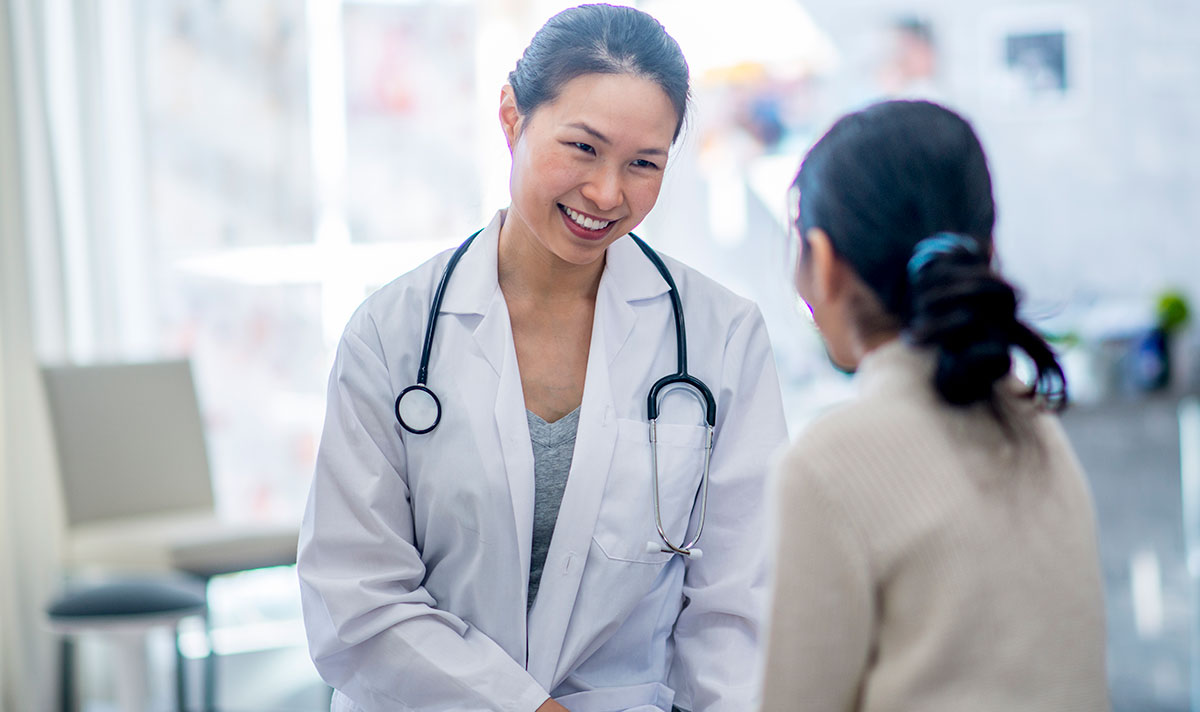 female doctor speaking with female patient