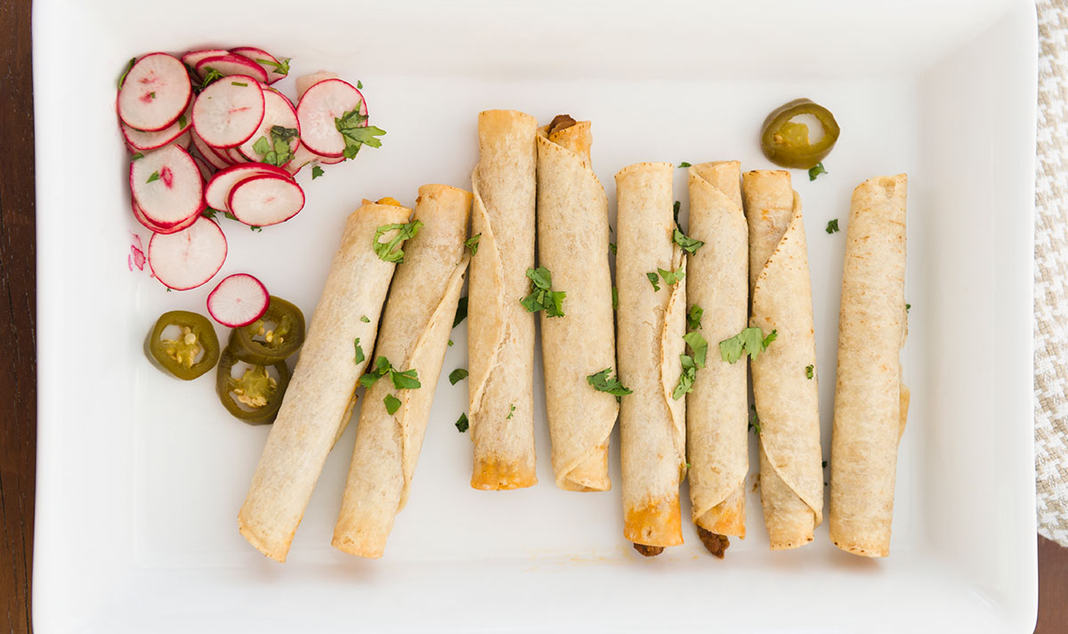 crispy taquitos on a plate