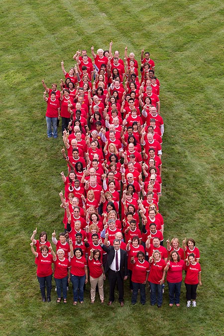 Harvard Pilgrim employees standing in the shape of the number 1